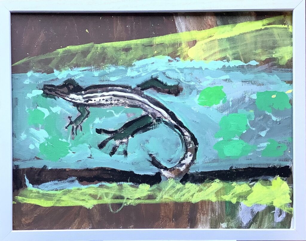 光をあびるカナヘビ