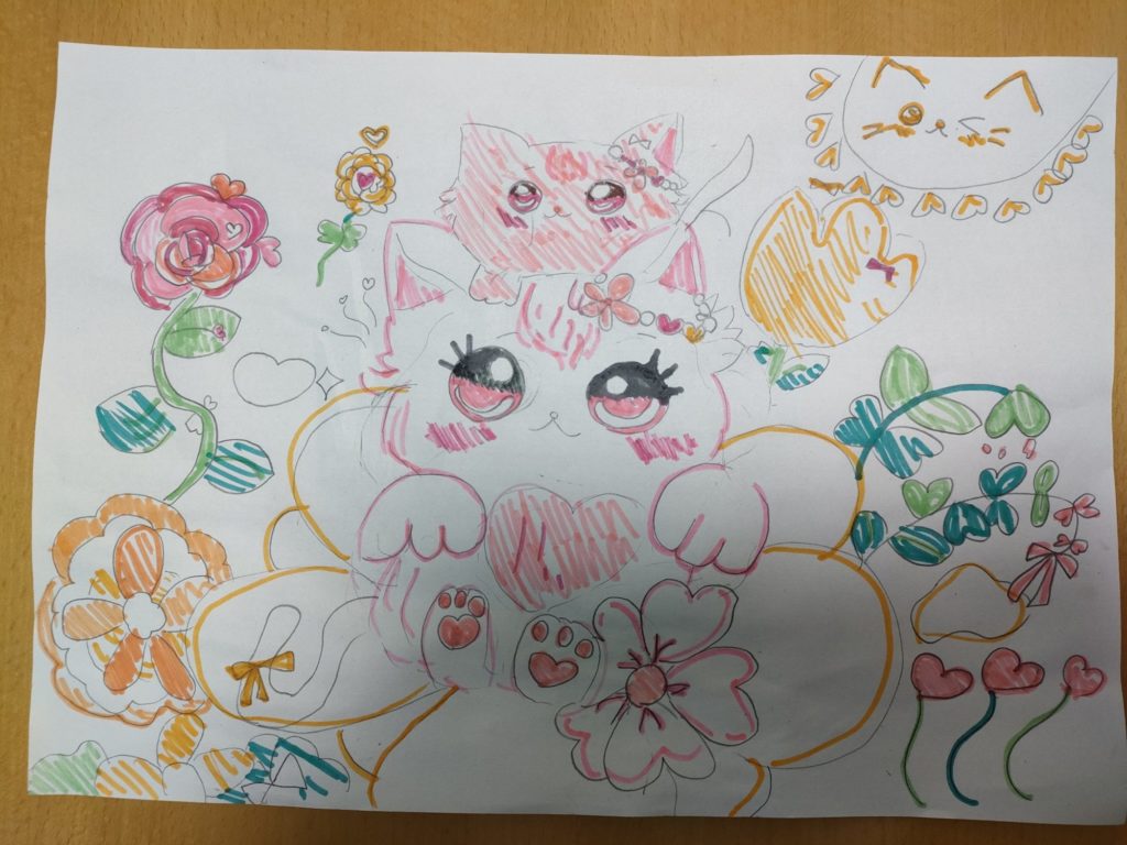 お花にかこまれたネコ