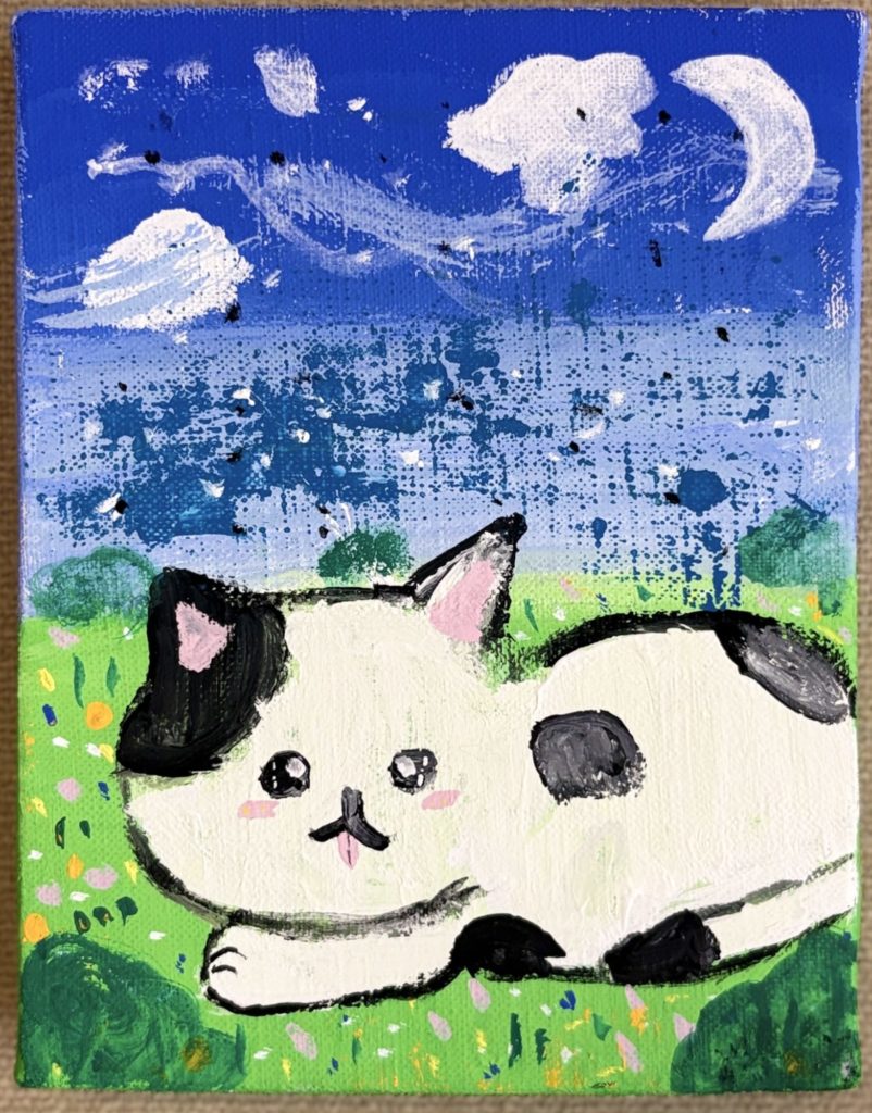 野原にいる子ネコ